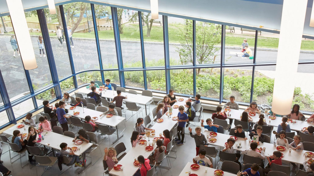 Window-lined walls in the Upper Learning Building showcase the beautiful surroundings.