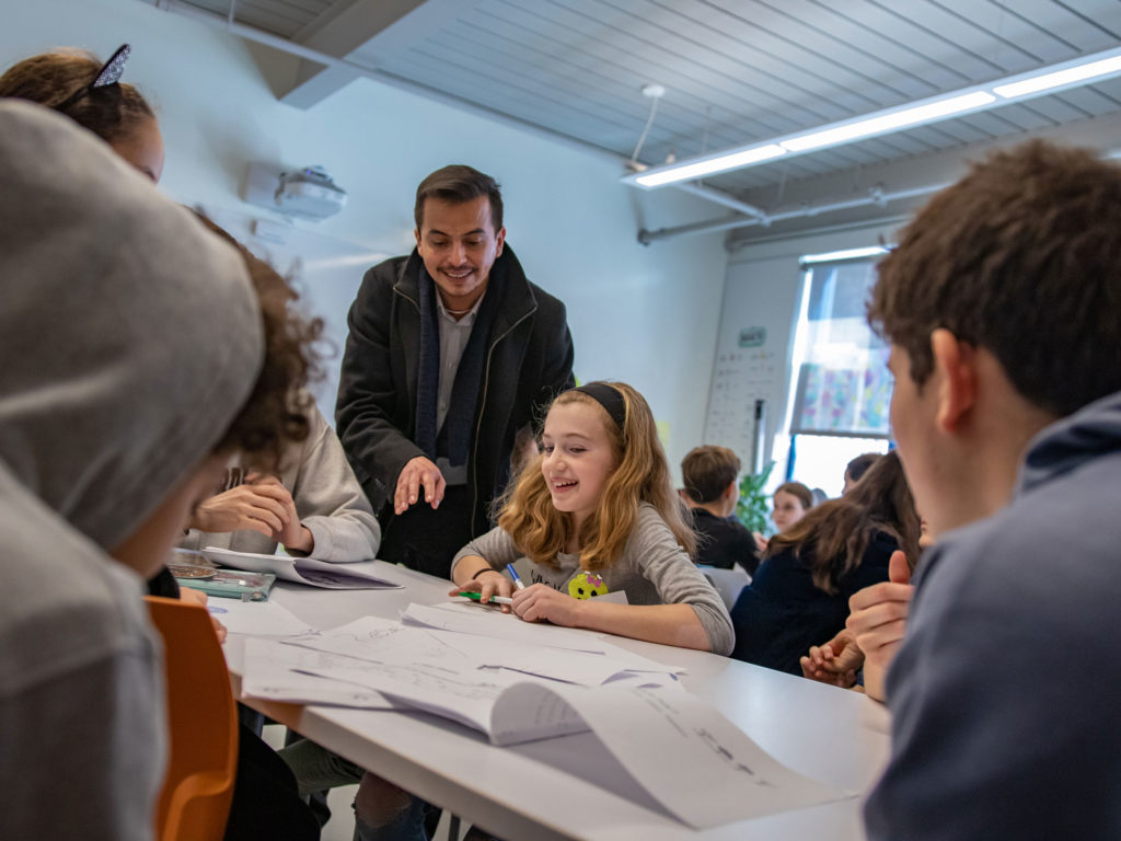 Dr. Cristián Baidal, an Upper School language teacher, takes part in a Lower School Spanish class