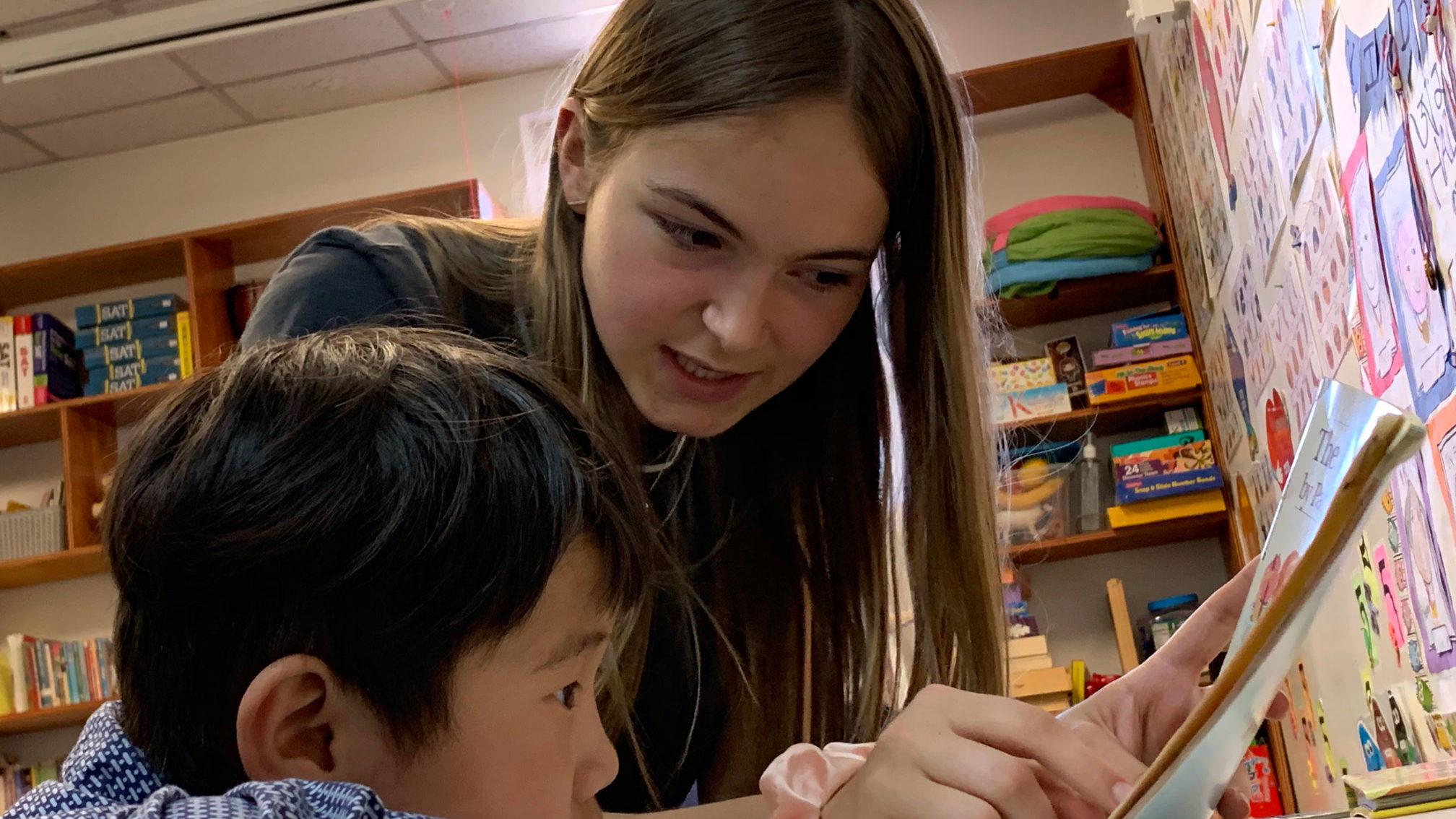 An Upper School student tutors a child at YindaYin Coaching, a nonprofit that works with Tibetan immigants and refugees in Jackson Heights, Queens.