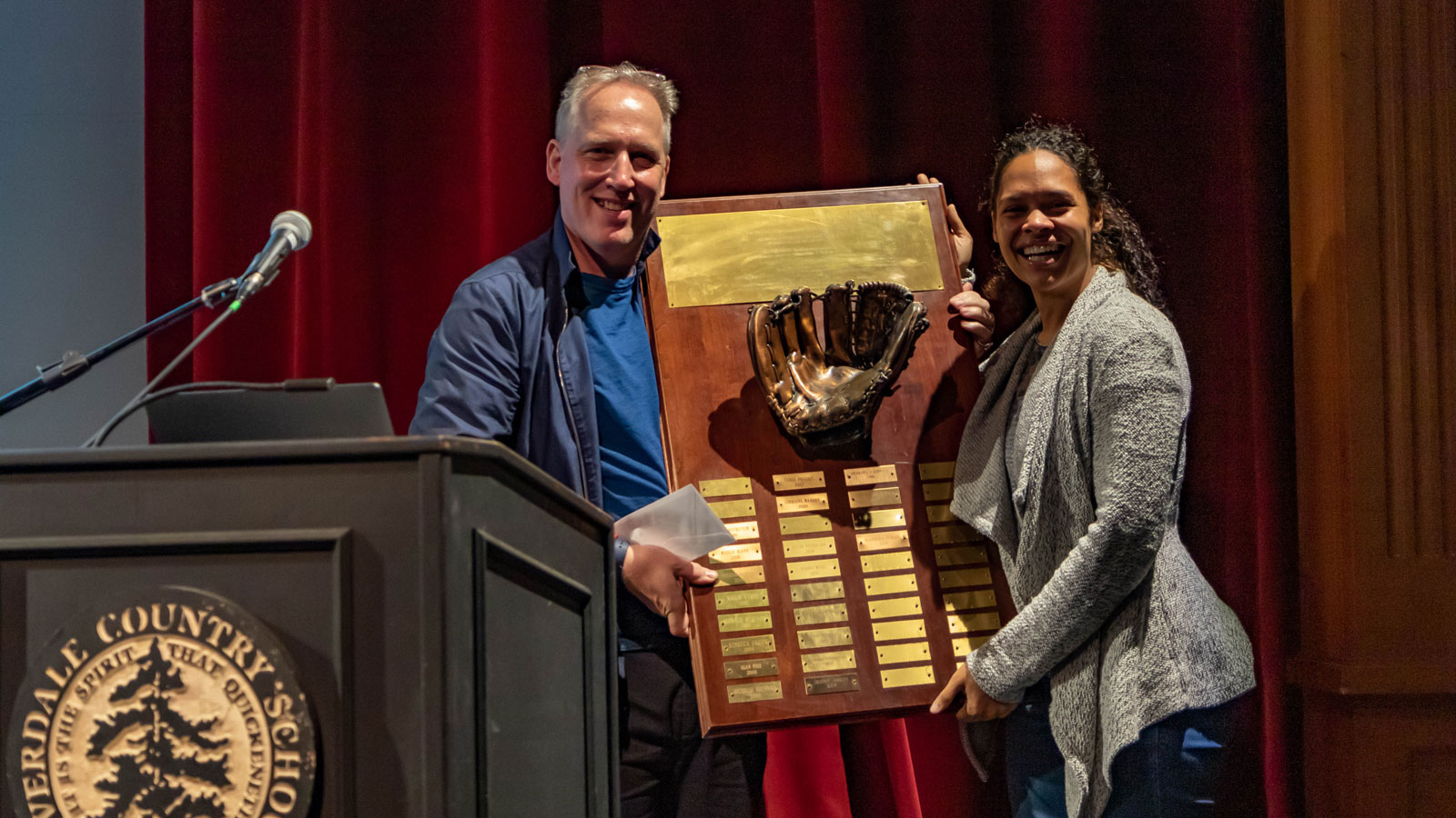 Head of School Dominic A. A. Randolph and Manisha Doran hold the plaque that includes her name.