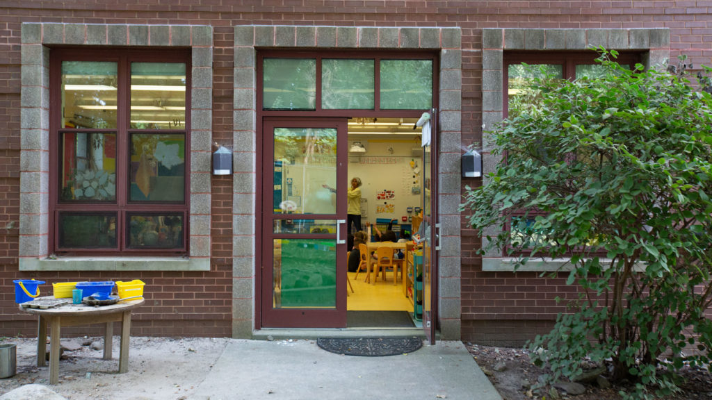 Kindergarten classrooms open onto play spaces.
