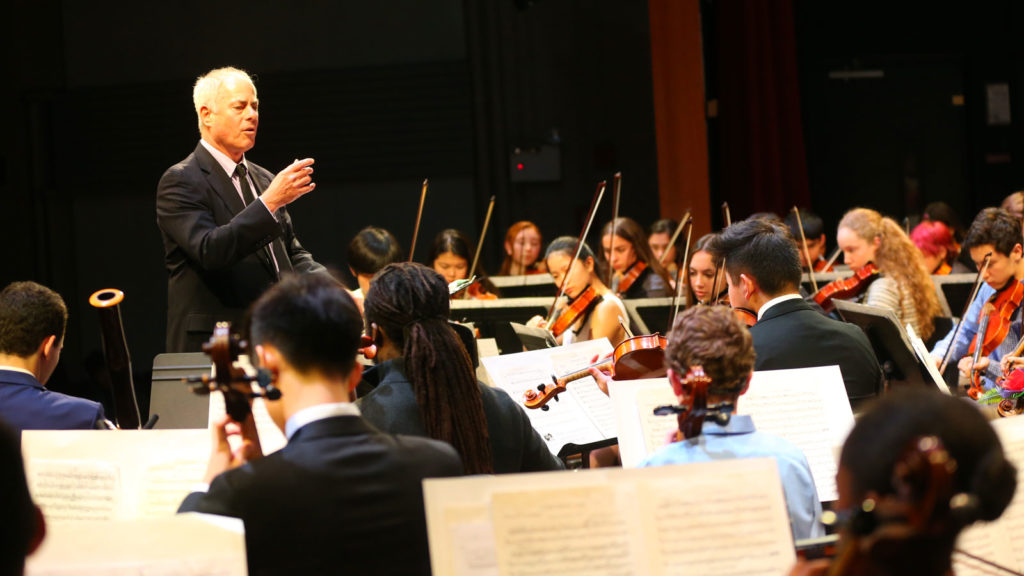 John Lettieri conducts the Riverdale orchestra.