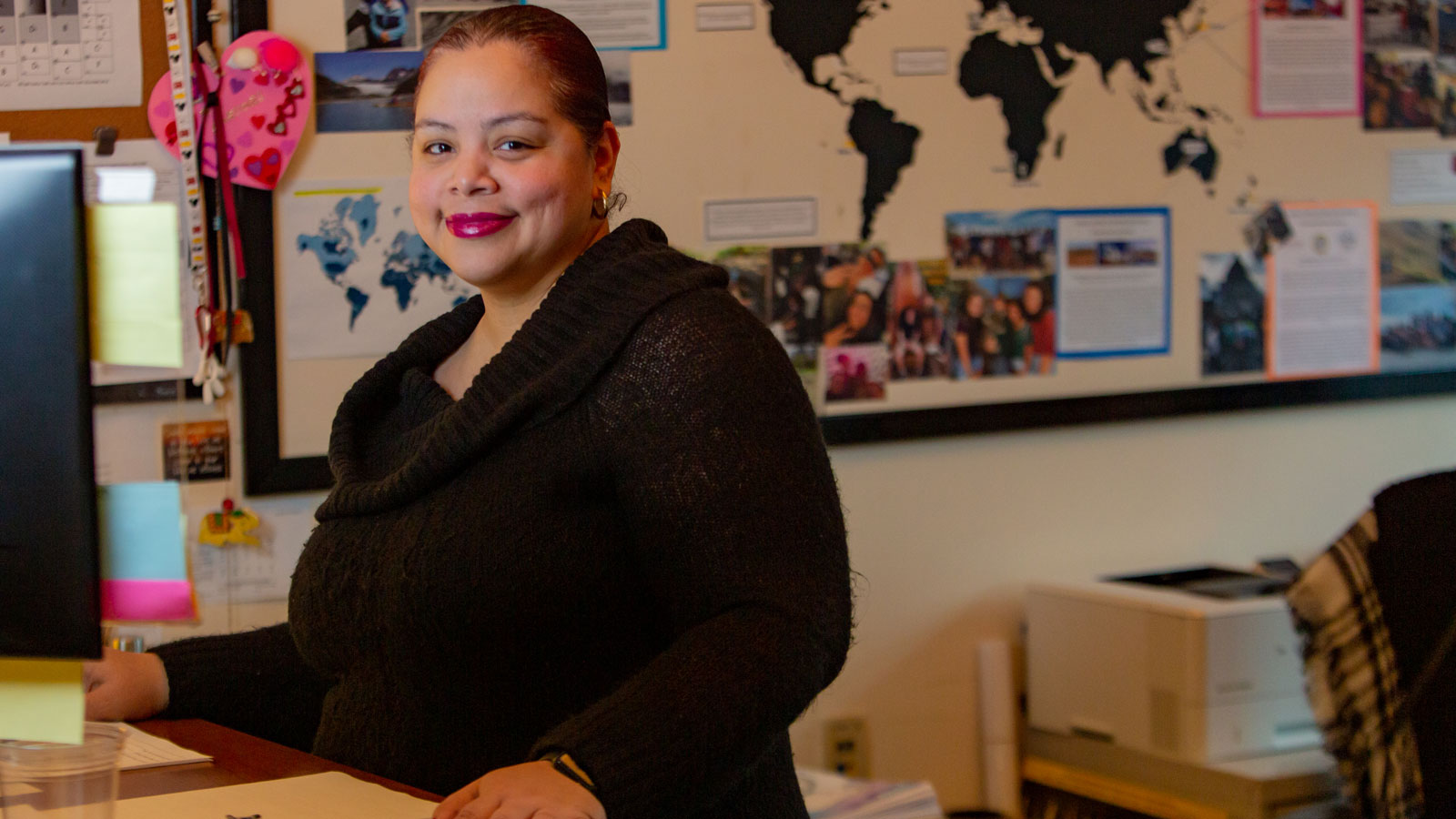 Alex Martinez at her desk in the Upper School office.