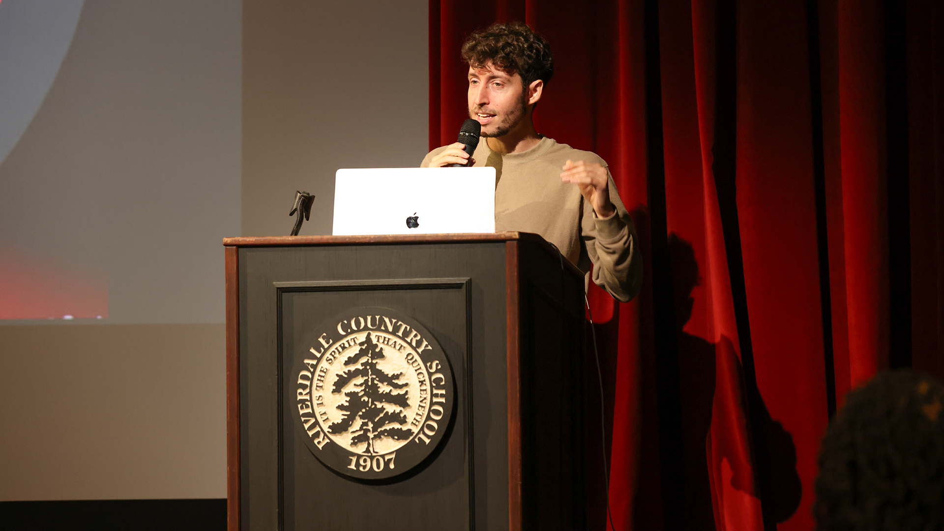 A person standing at a podium