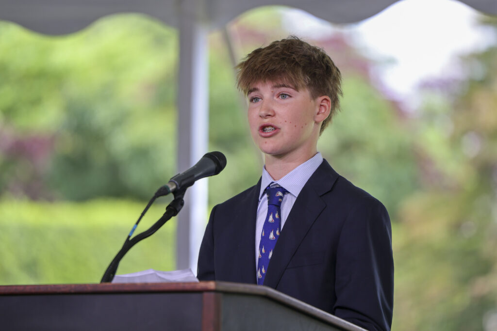 A student speaks at a podium